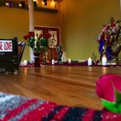 Karma Yoga Center sacred altar with Choose Love sign and candles
