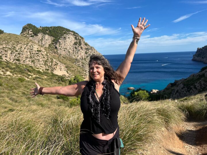 Katrina Gustafson on cliff overlooking the ocean